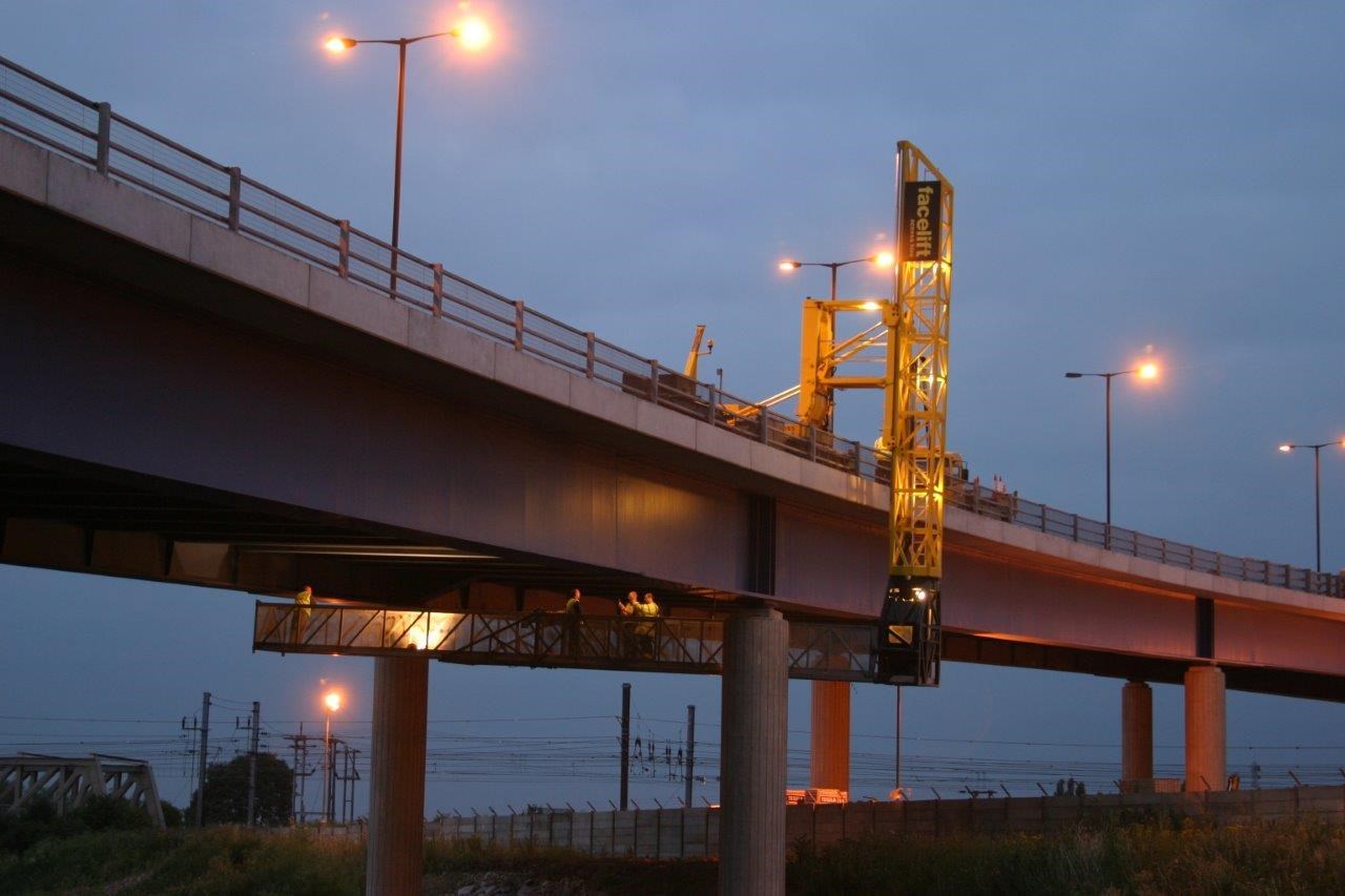 Yellow scaffolding tower allowing access to the underneath of St. George's Bridge.